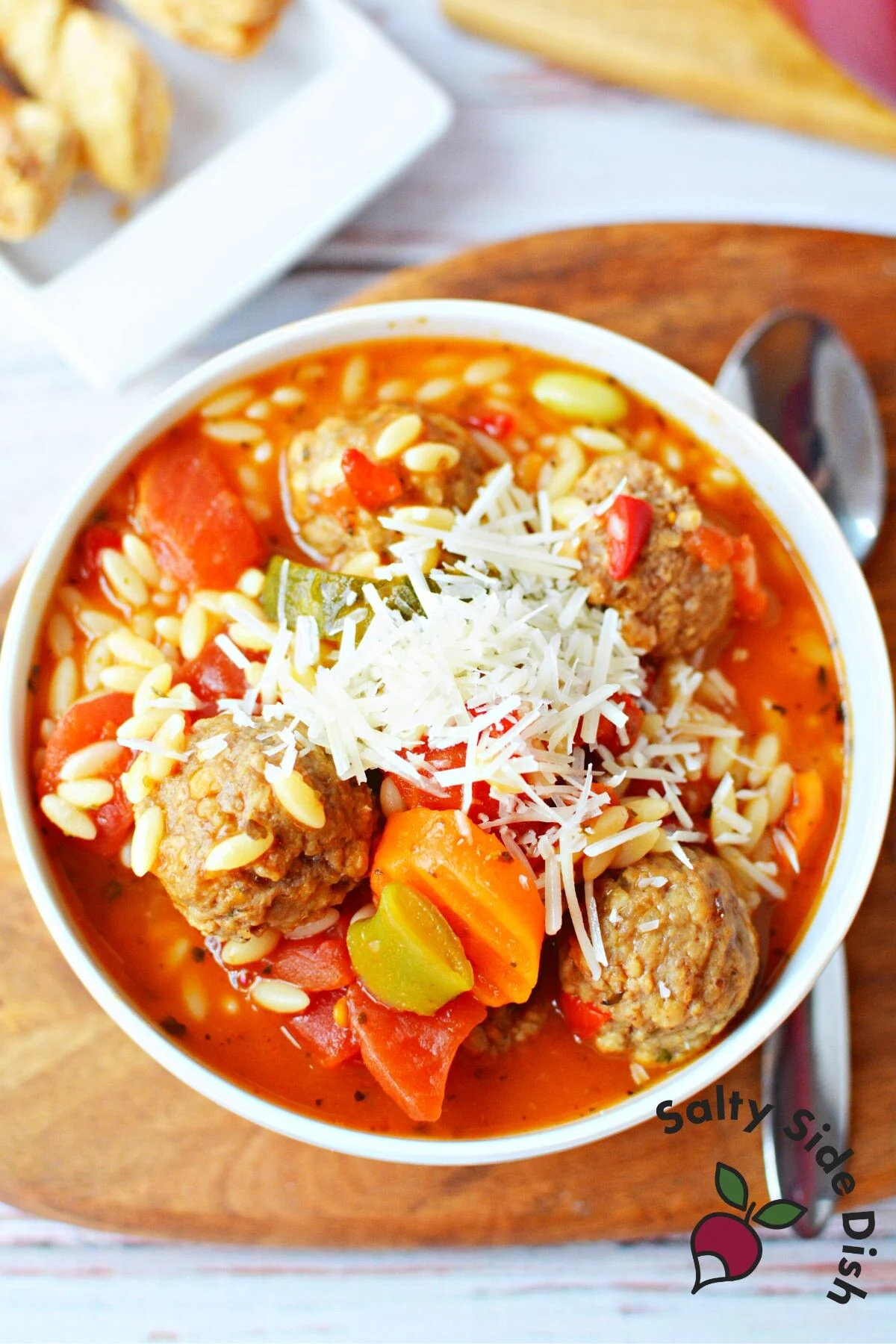 large bowl of italian vegetables and meatball soup.