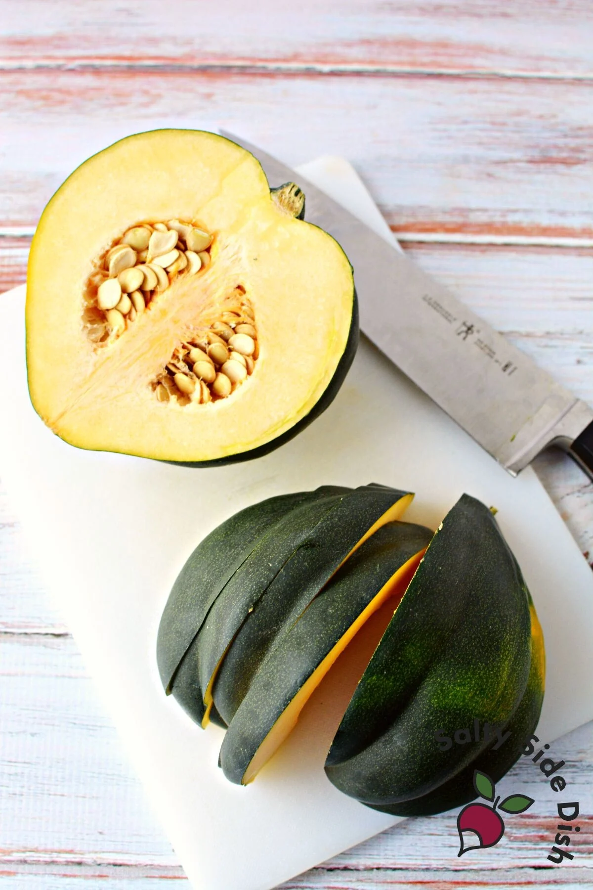 acorn squash on a cutting board.