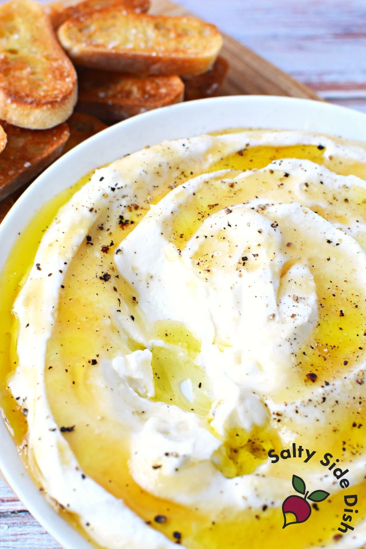 simple ricotta whipped dip in a bowl with honey.
