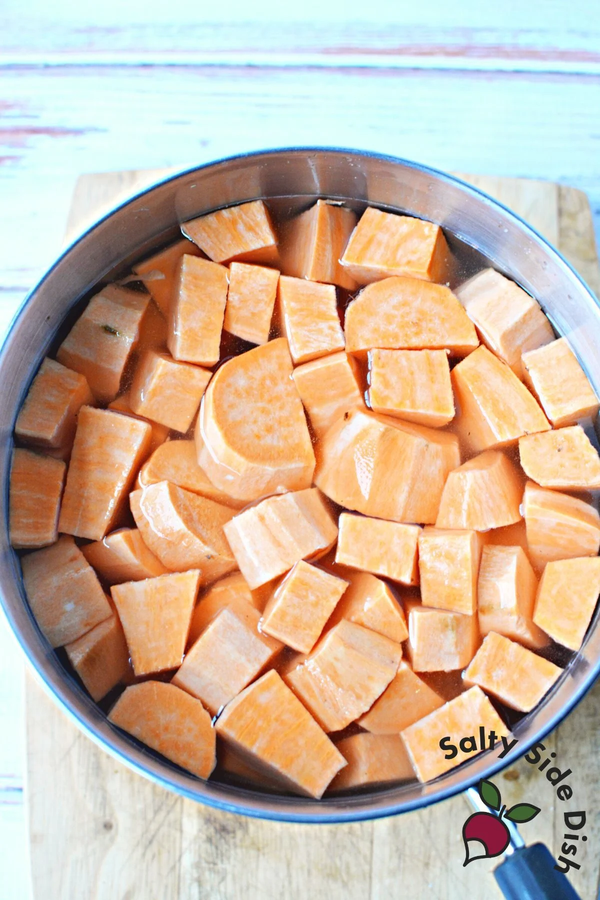 boiling sweet potatoes on stovetop.