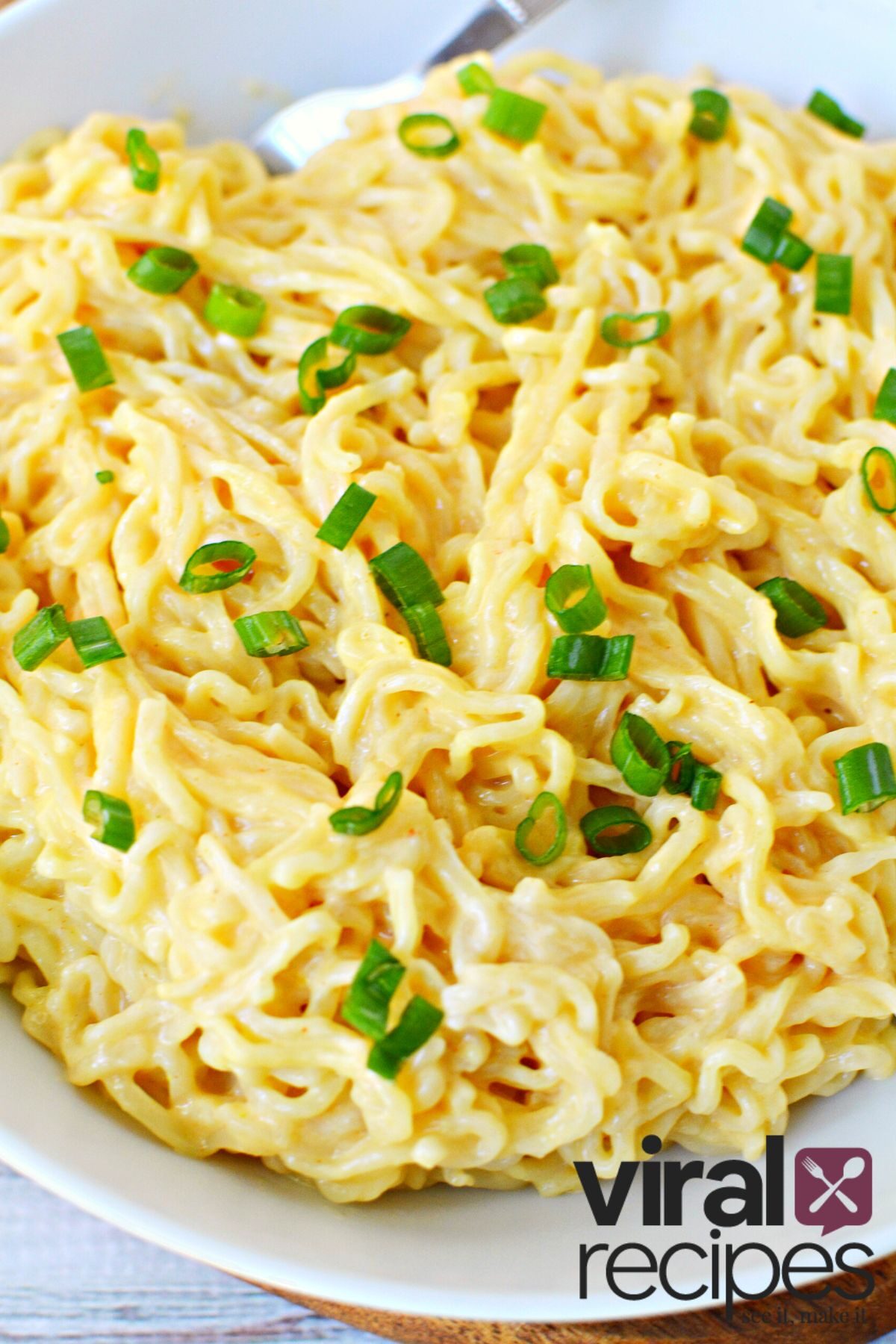 huge plate of ramen noodles with buffalo chicken sauce.