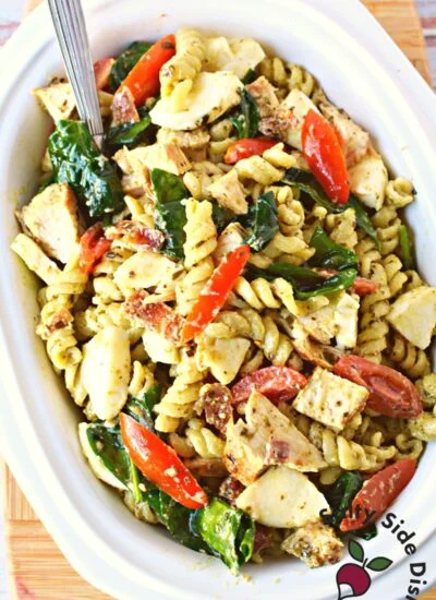 chicken pesto pasta salad in a large dish.