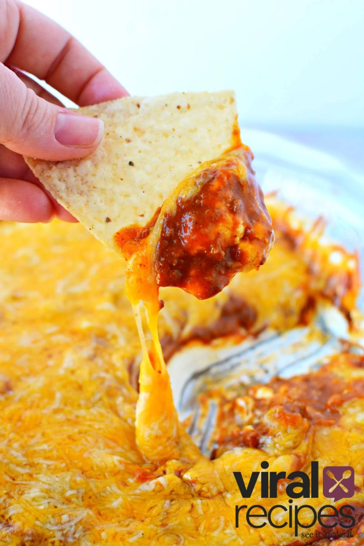 tortilla chip with chili dip.