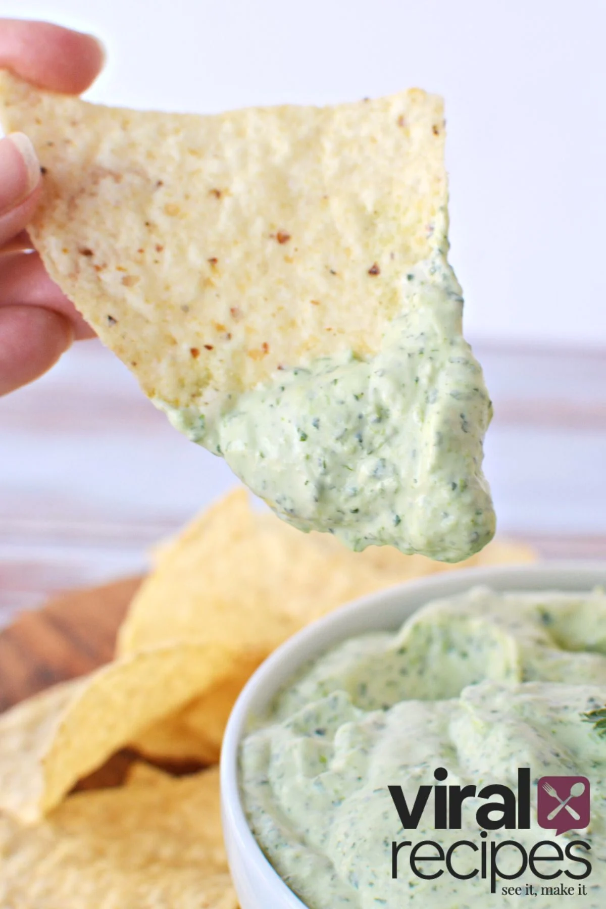 simple green dip recipe with tortilla chip.