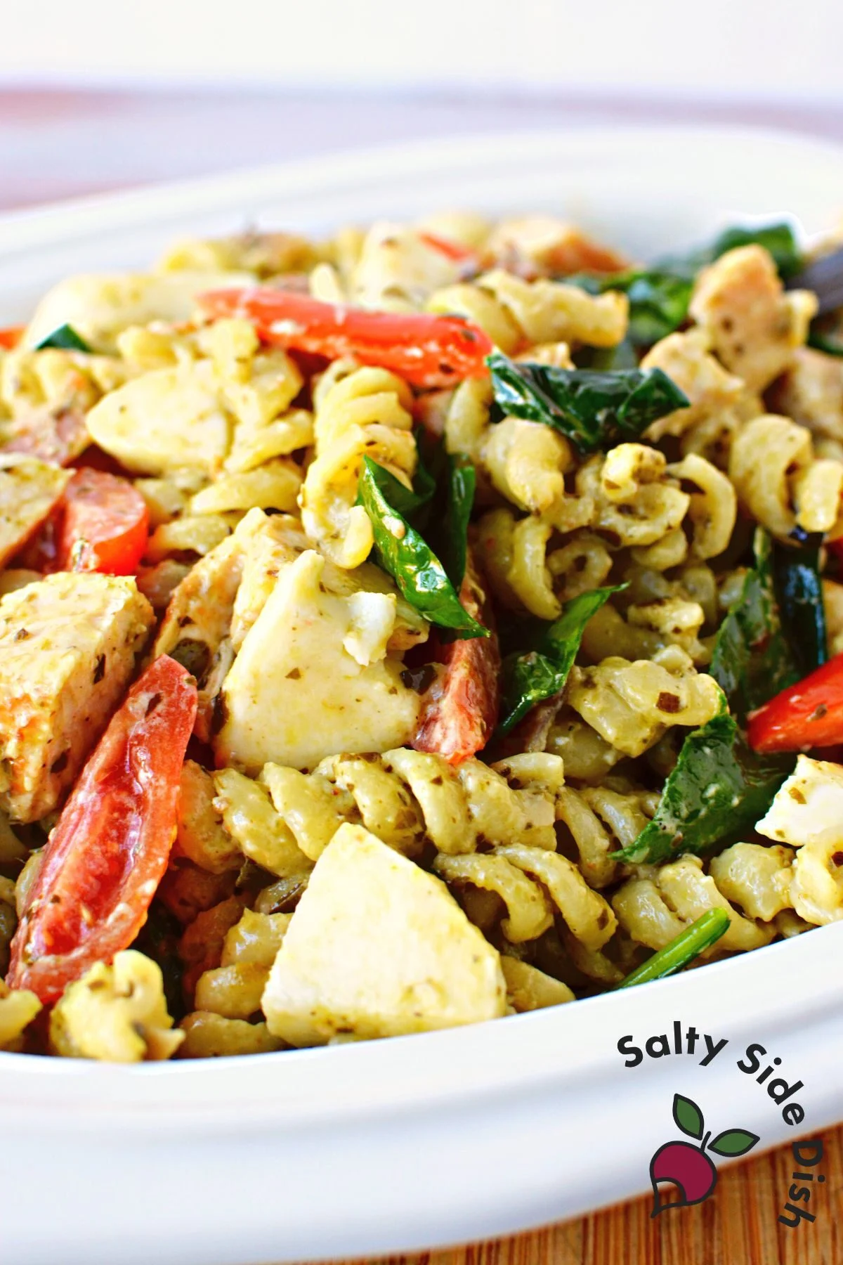 white dish with potluck salad.