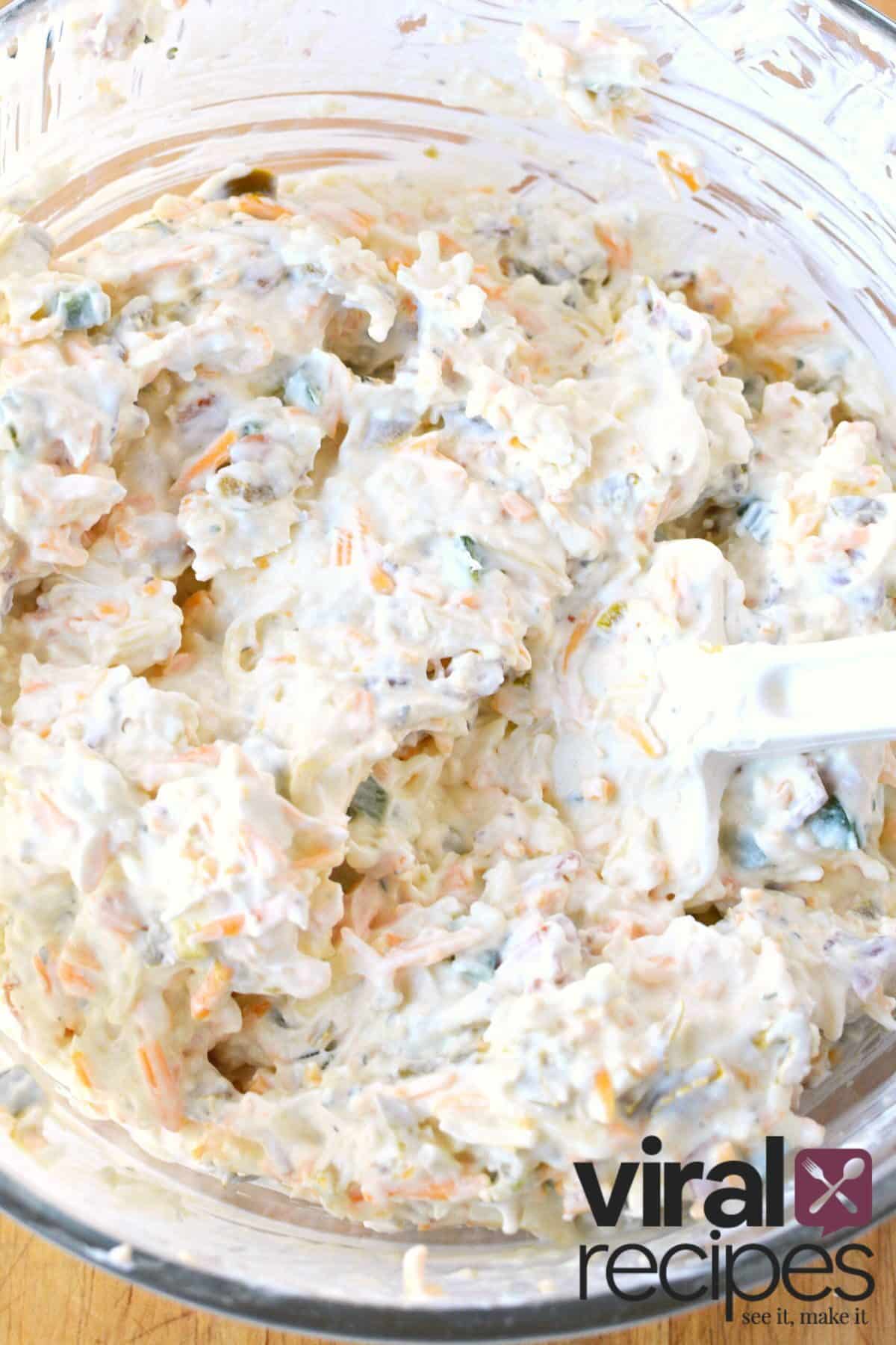 mixing up cream cheese jalapeno dip.