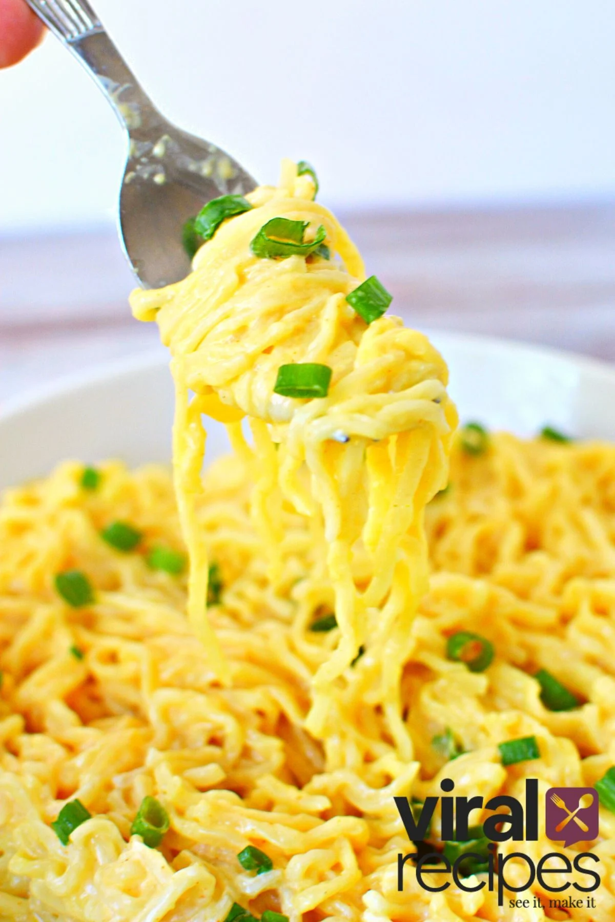 twirling a fork w/ ramen noodles.