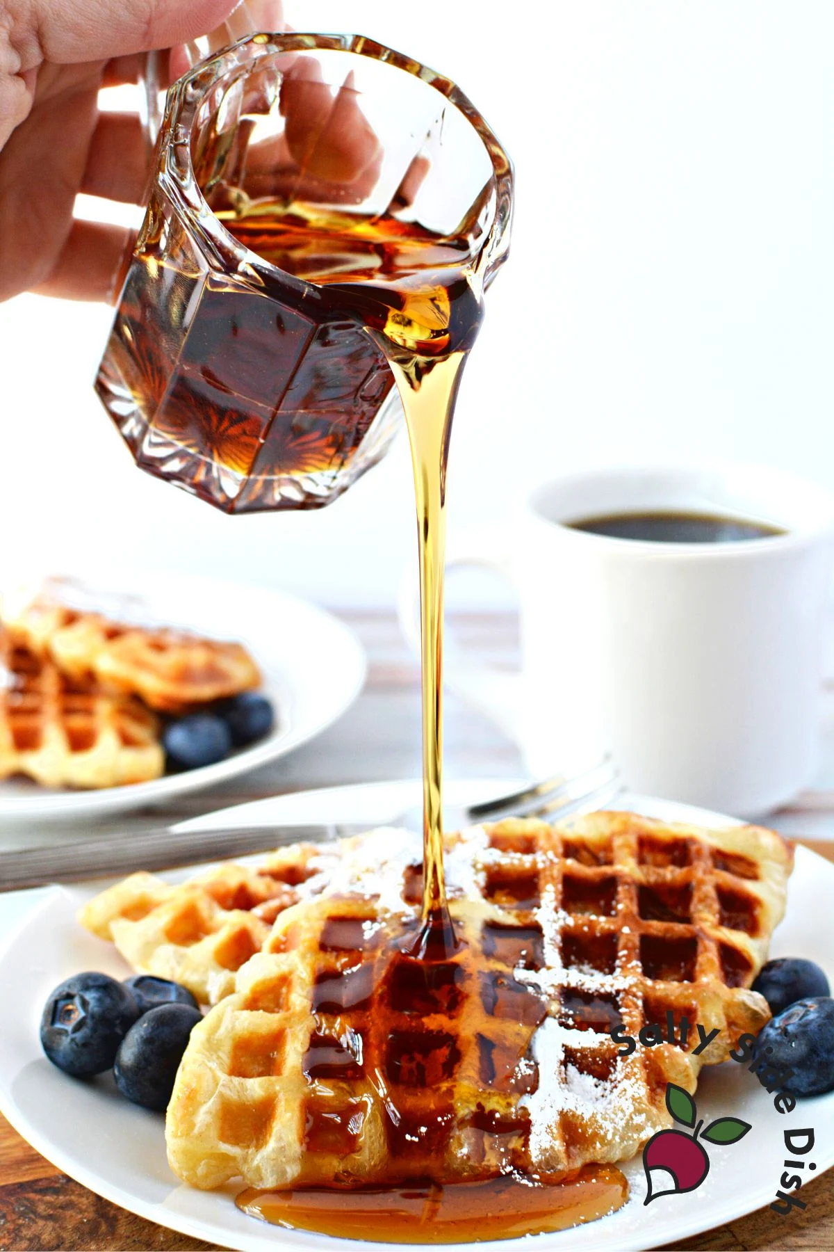 pouring maple syrup on this breakfast plate.