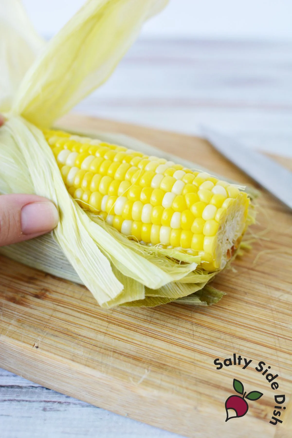 removing husks from corn on the cob.