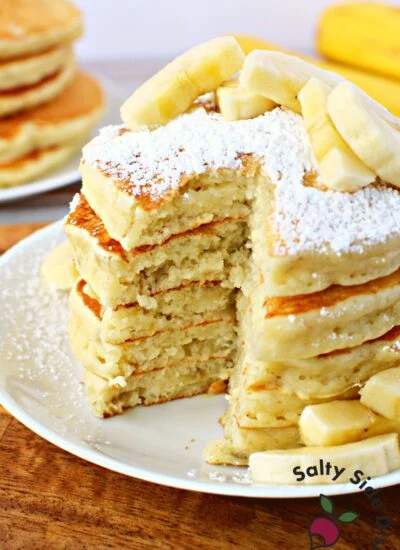 fluffy banana pancakes on a plate.