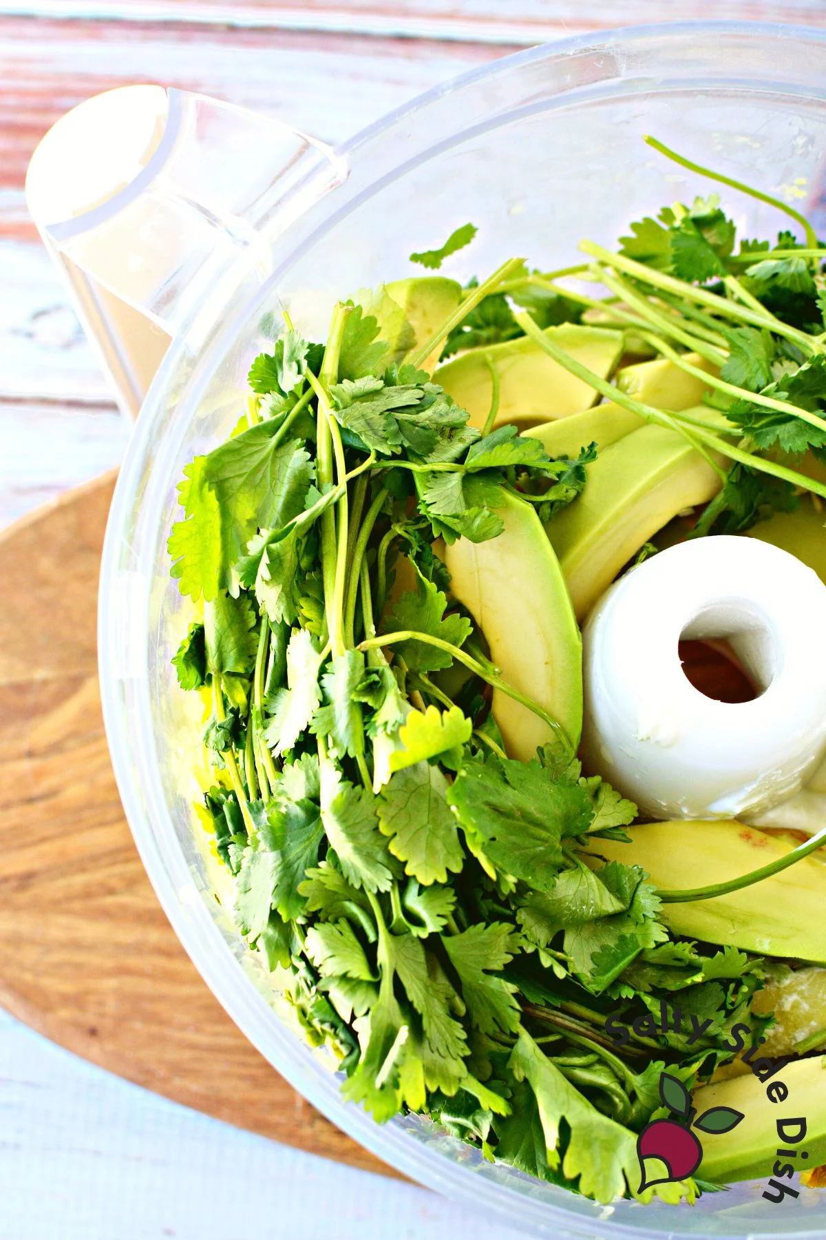 basic avocado dip recipe ingredients in a mixer.