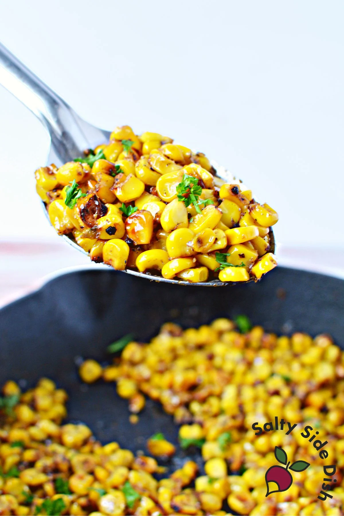 spoon of charred corn.