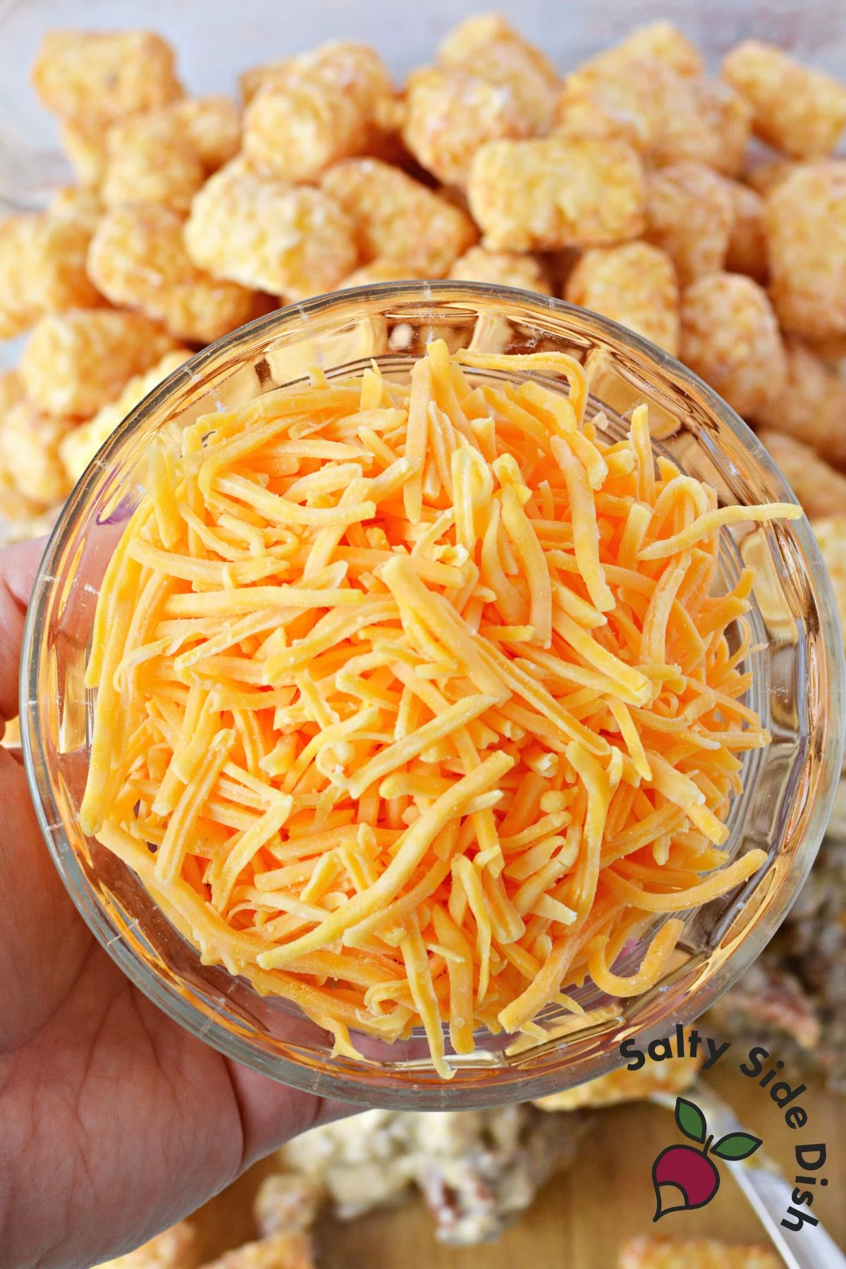 shredded cheddar cheese in a bowl.