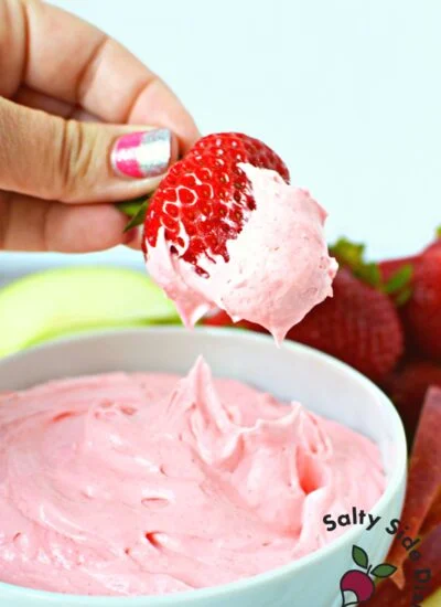 delicious strawberry fruit dip being dipped with a real ripe strawberry.