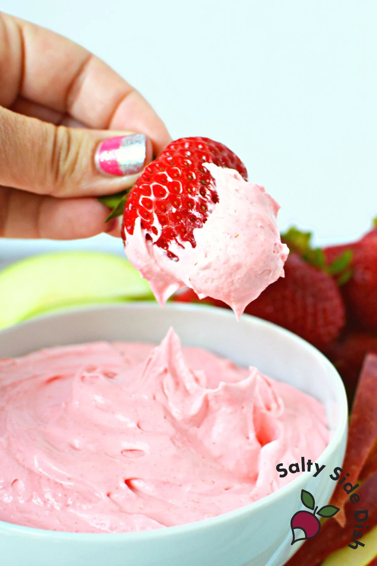 delicious strawberry fruit dip being dipped with a real ripe strawberry.