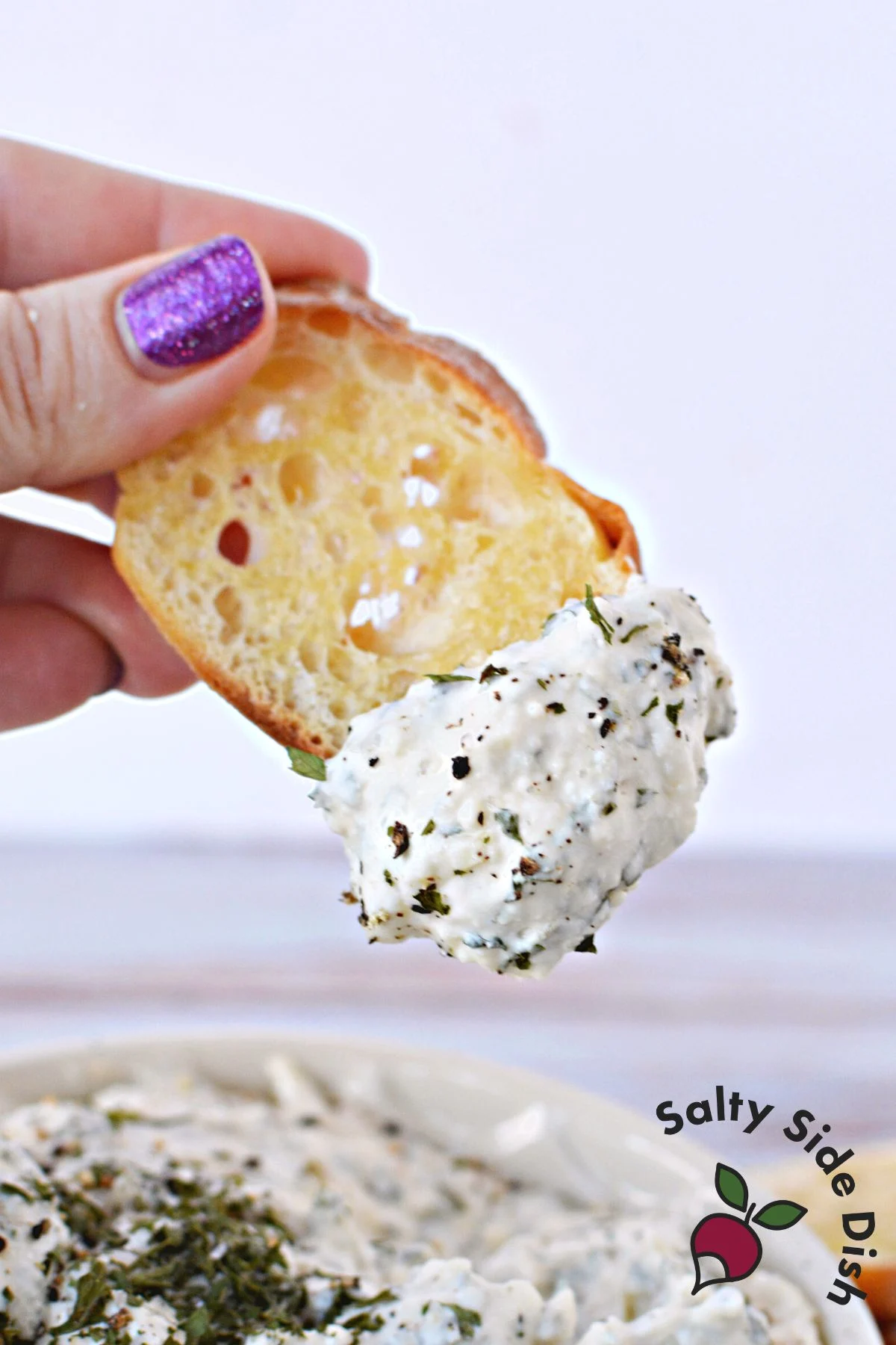 delicious garlic dip on a freshly toasted piece of bread.