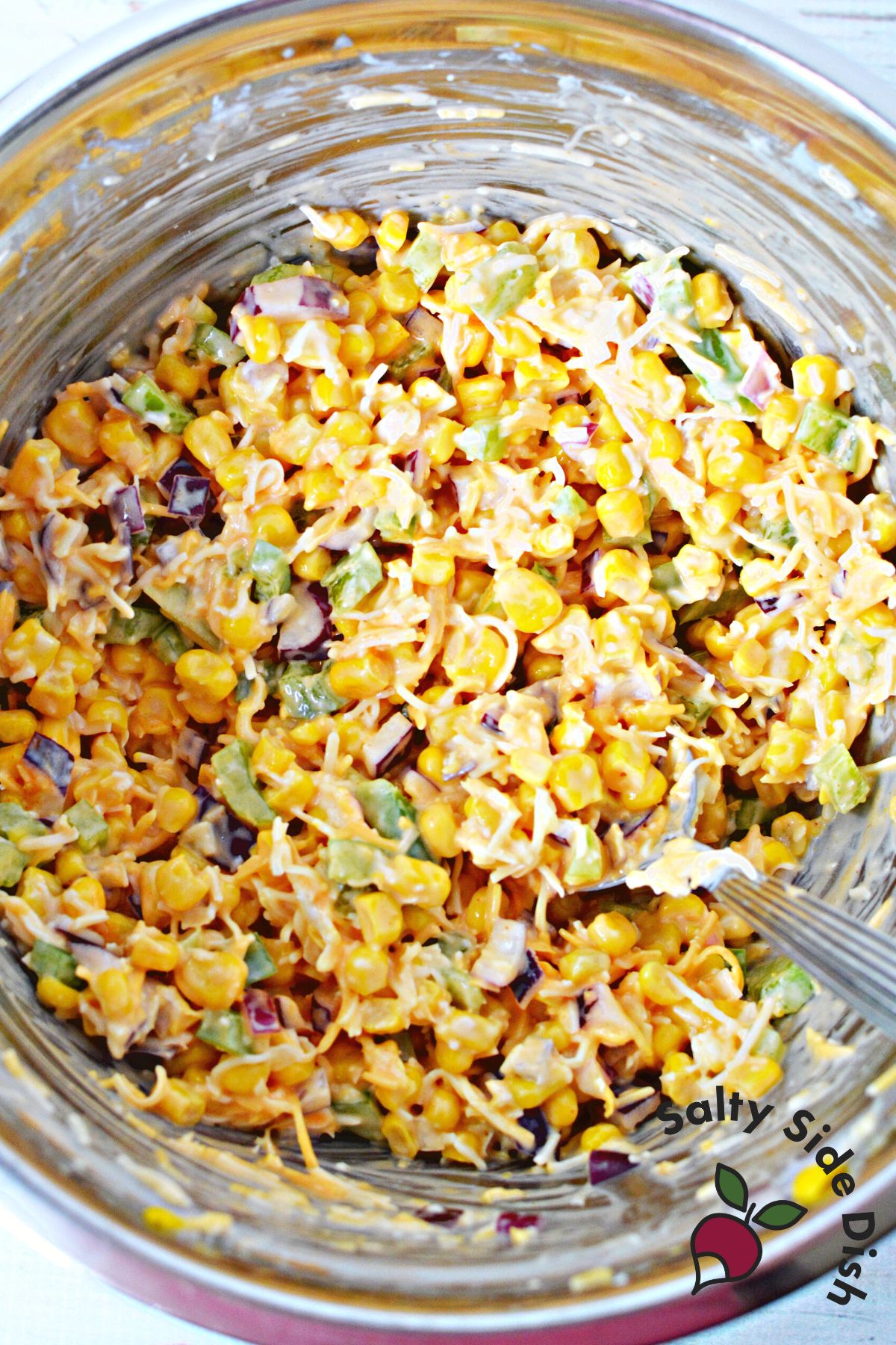 salad ingredients in a mixing bowl.