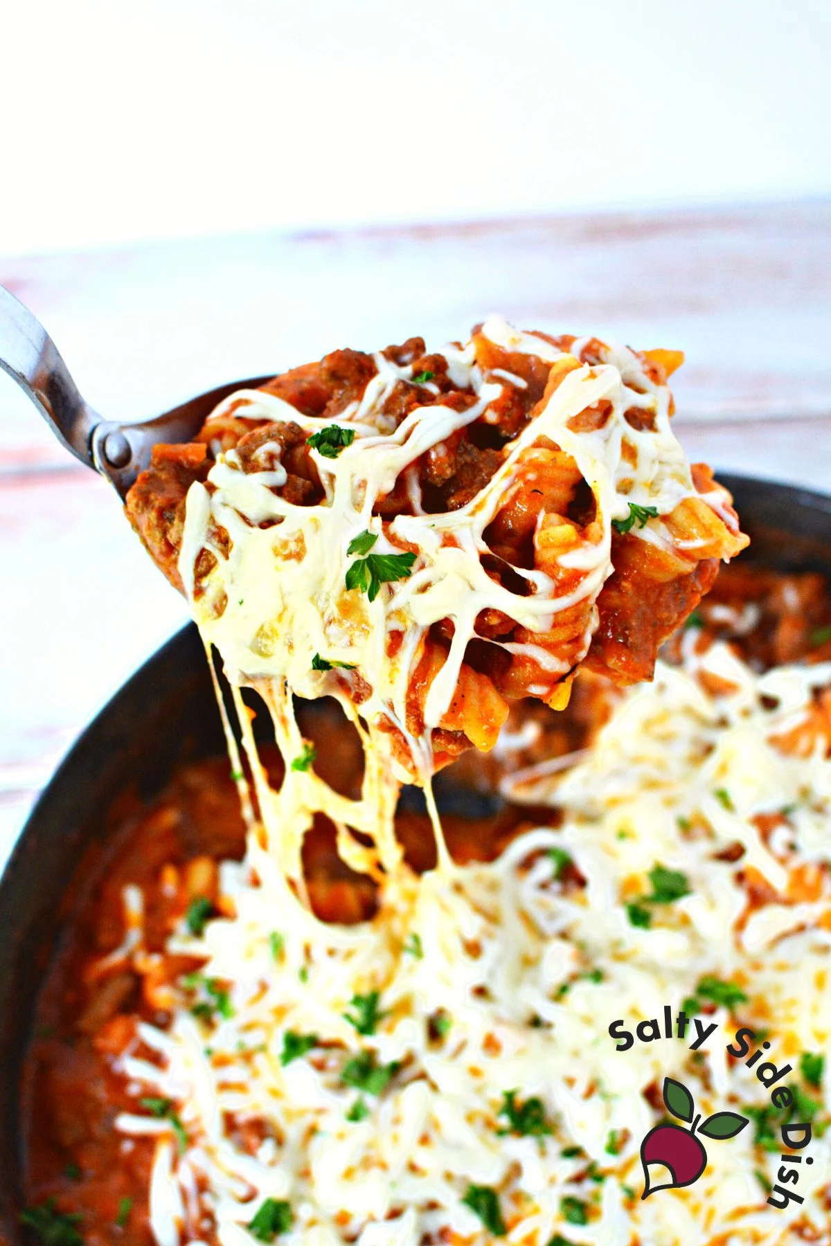 try out this easy family friendly kid friendly dinner idea with hamburger helper lasagna dripping from a cheesy spoon.