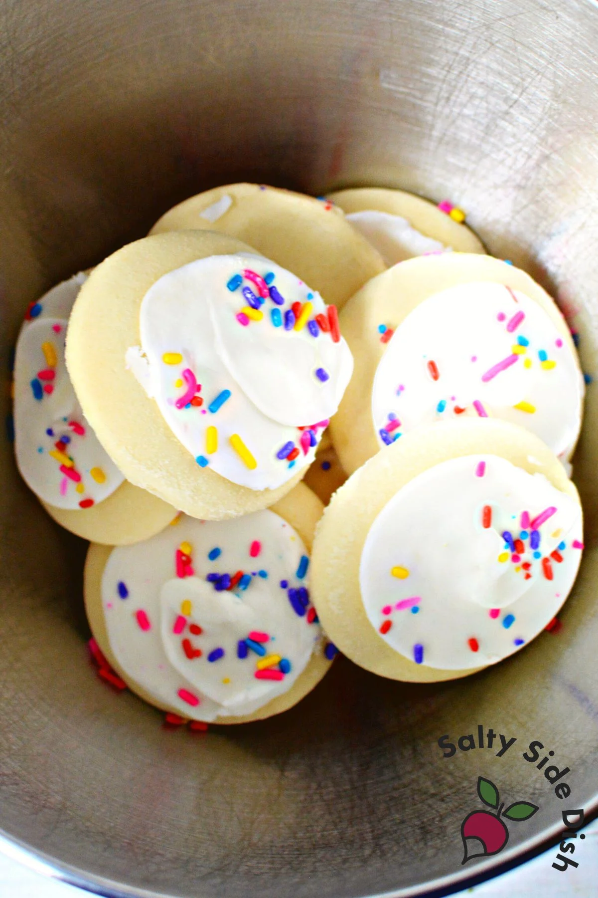 premade lofthouse style cookies in a mixing bowl.