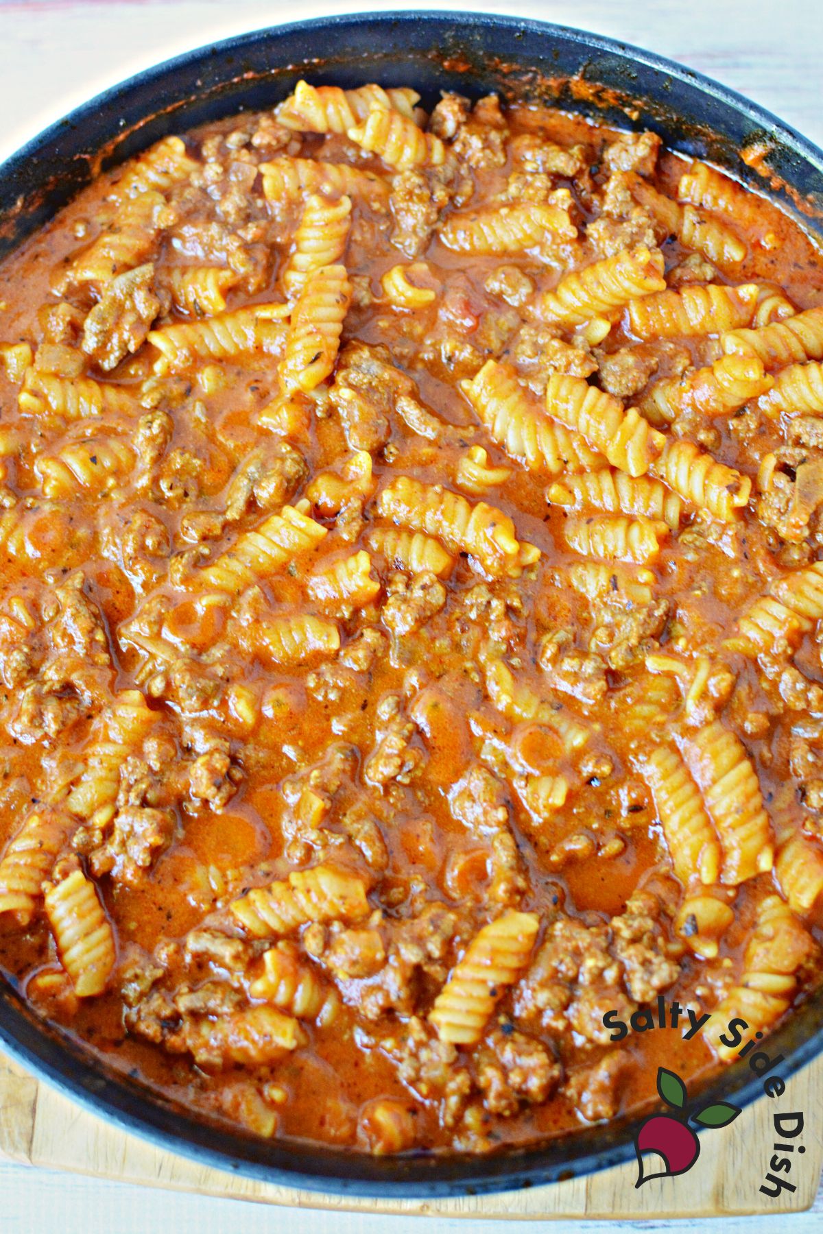 sauce mixture with pasta and beef in a one pan skillet.