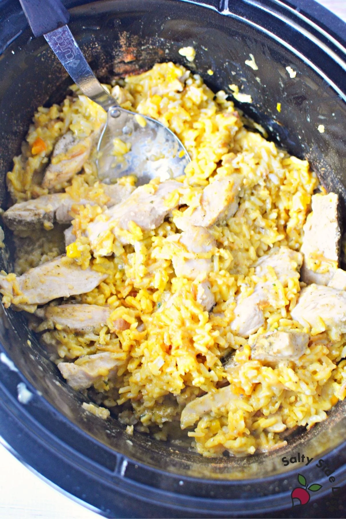 mix together cooked chicken and cooked rice in crockpot.