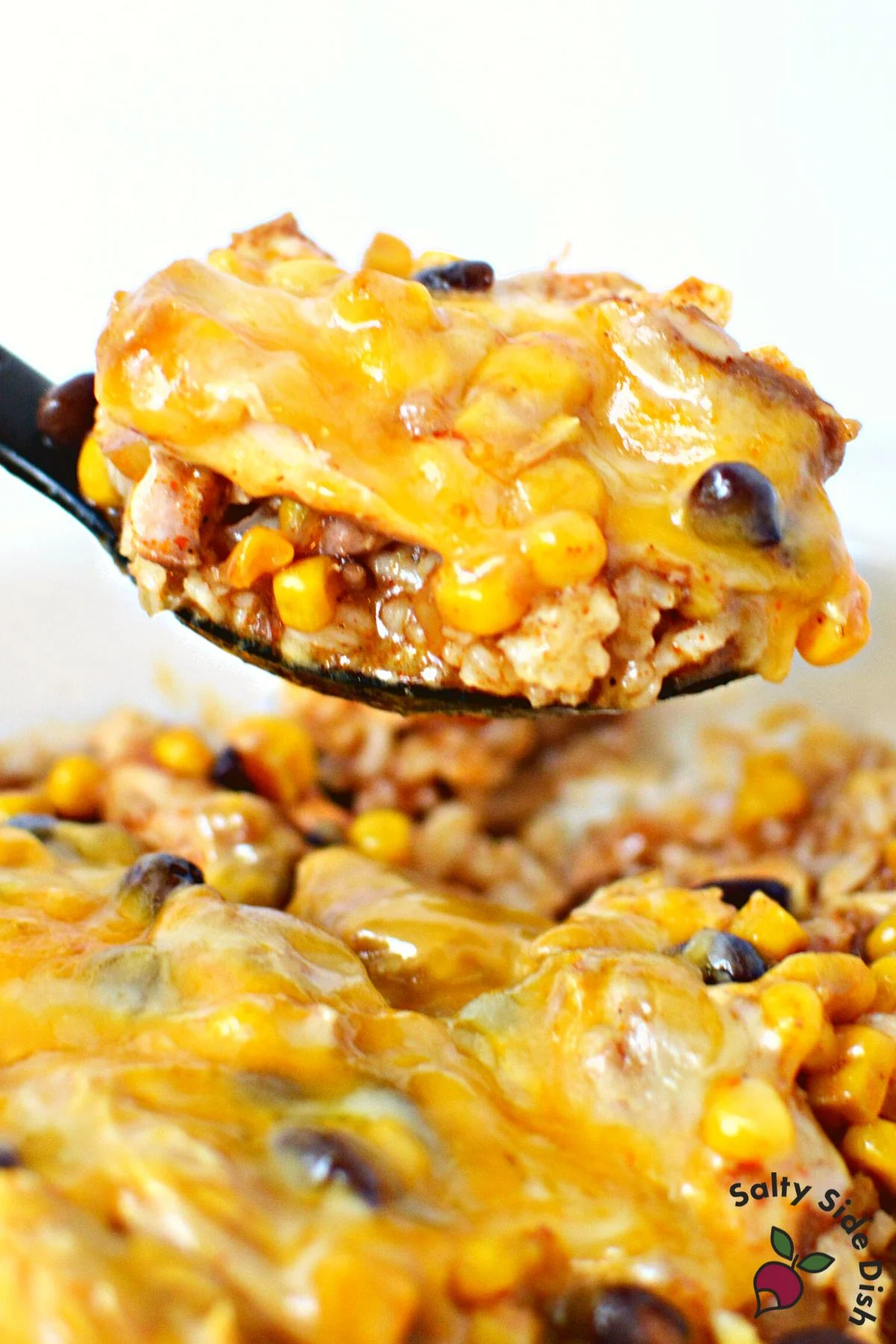 enchilada casserole on a spoon.