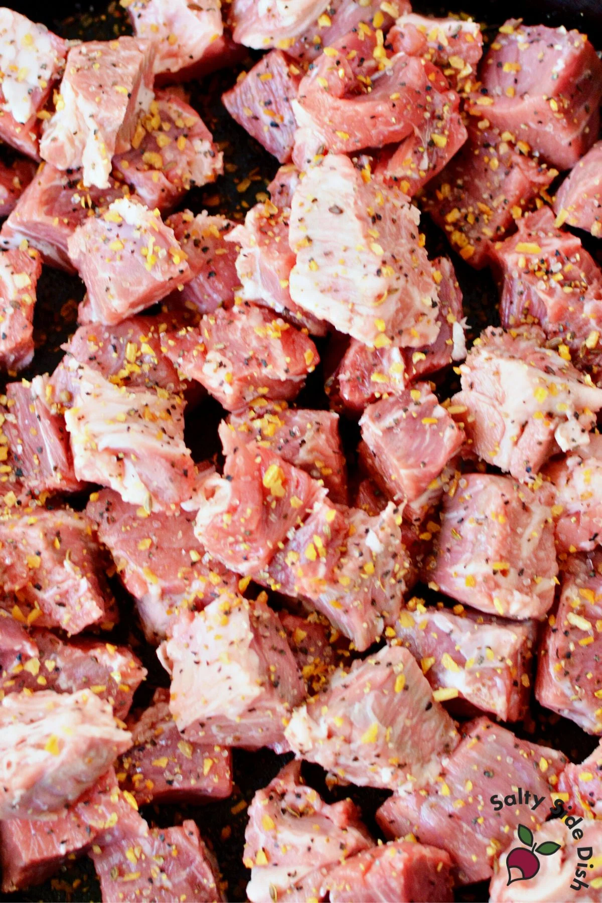 cut up beef for cooking.