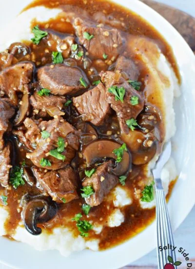 beef sirloin tip on top of mashed potatoes.