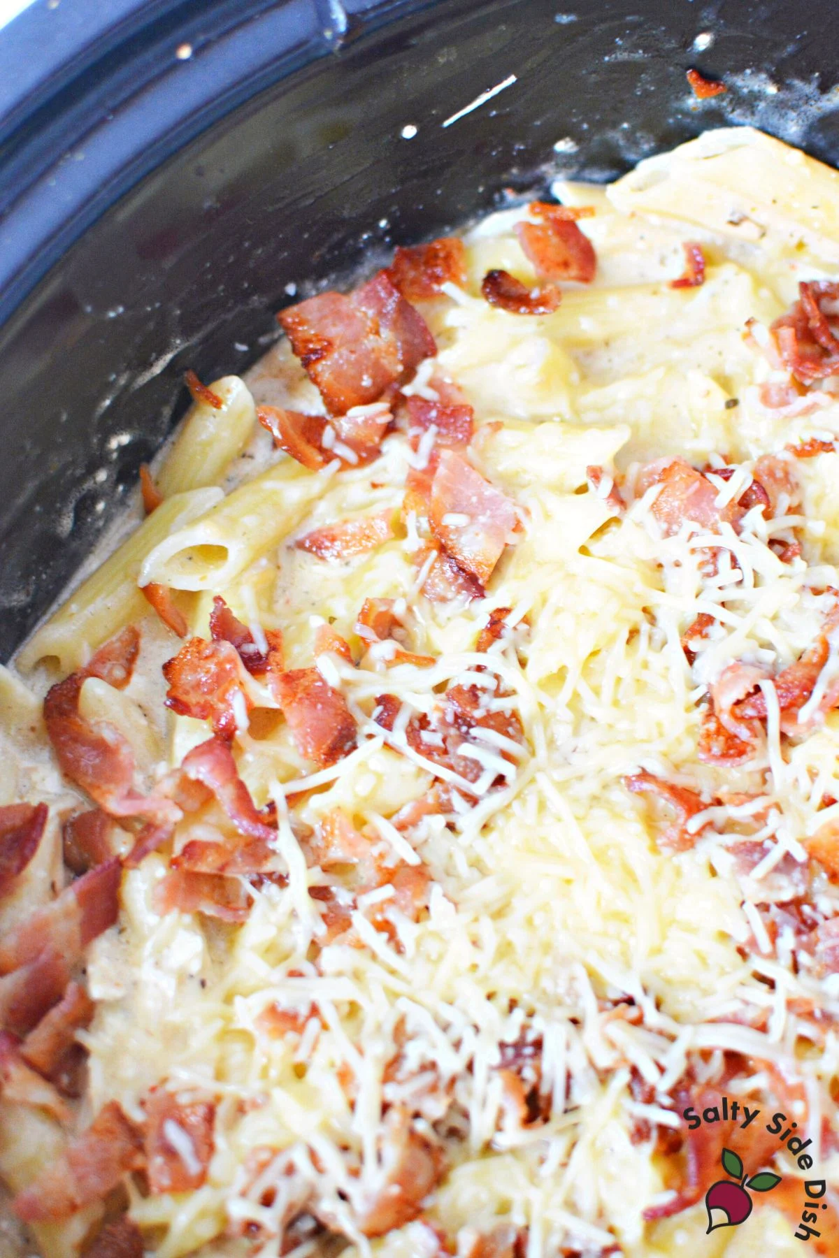 shredded parmesan cheese on fork tender chicken.
