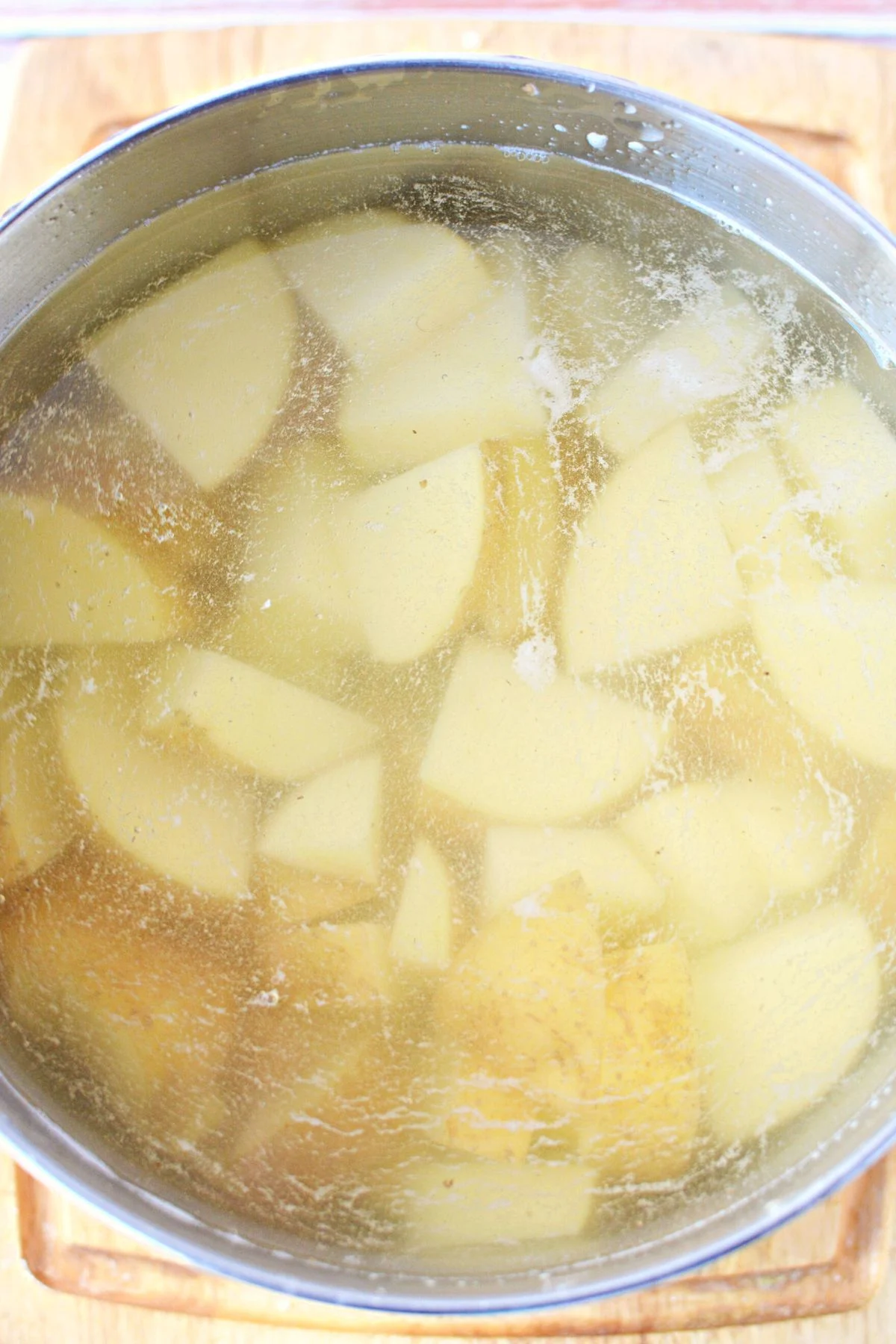 boiling potatoes in a pan.