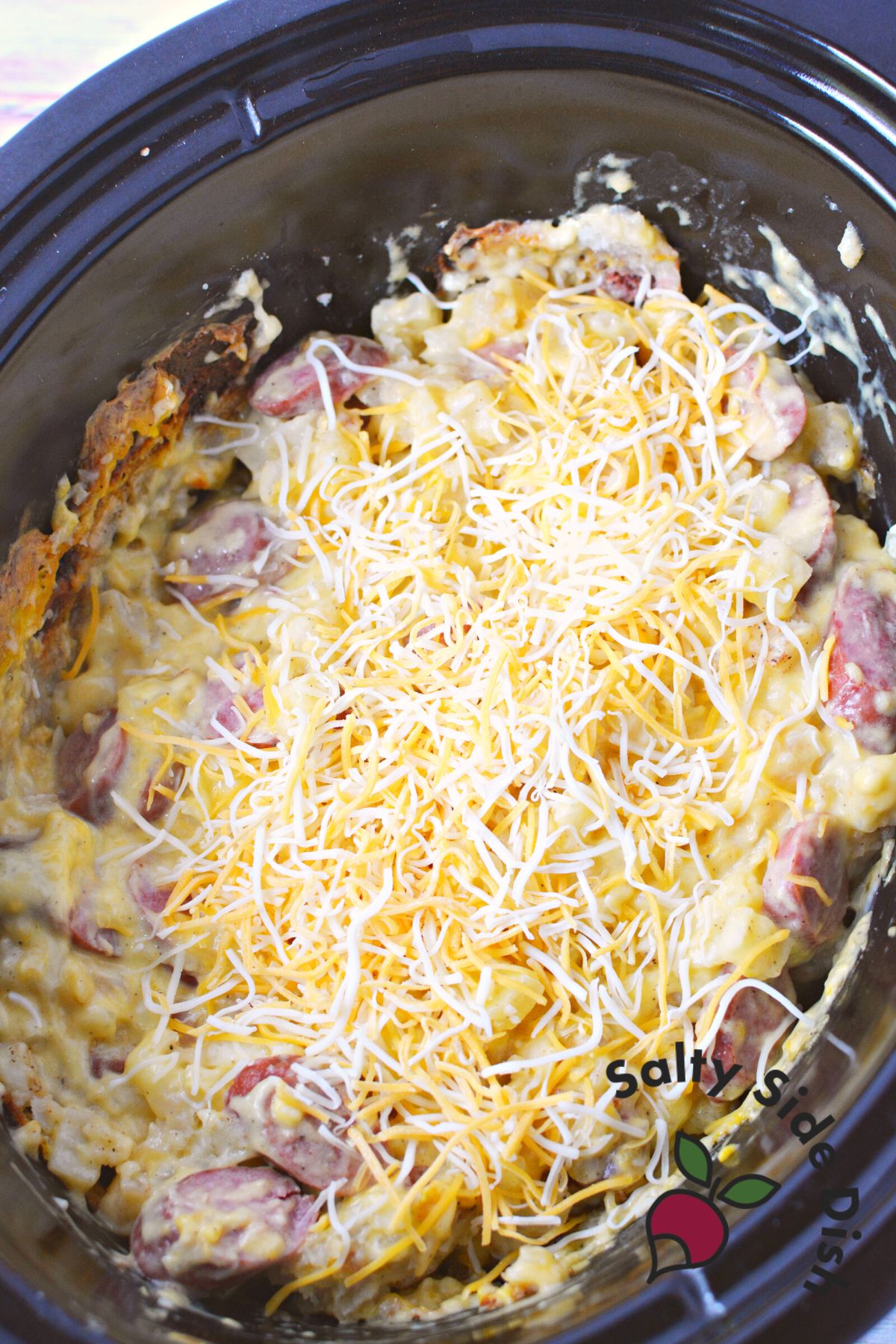 sausage and cheese and potatoes in a slow cooker as a side dish.