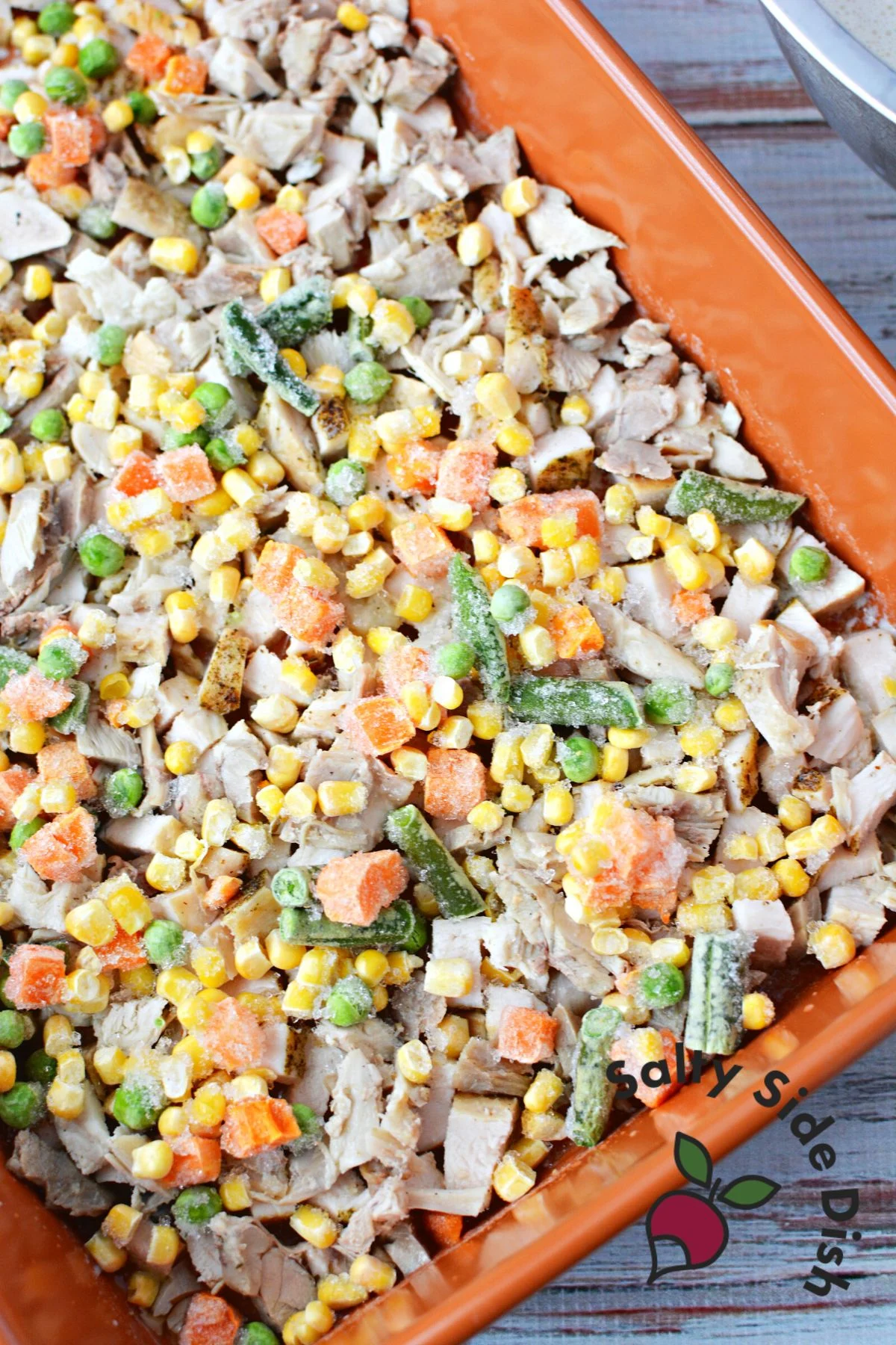 frozen veggies on top of cooked chicken.