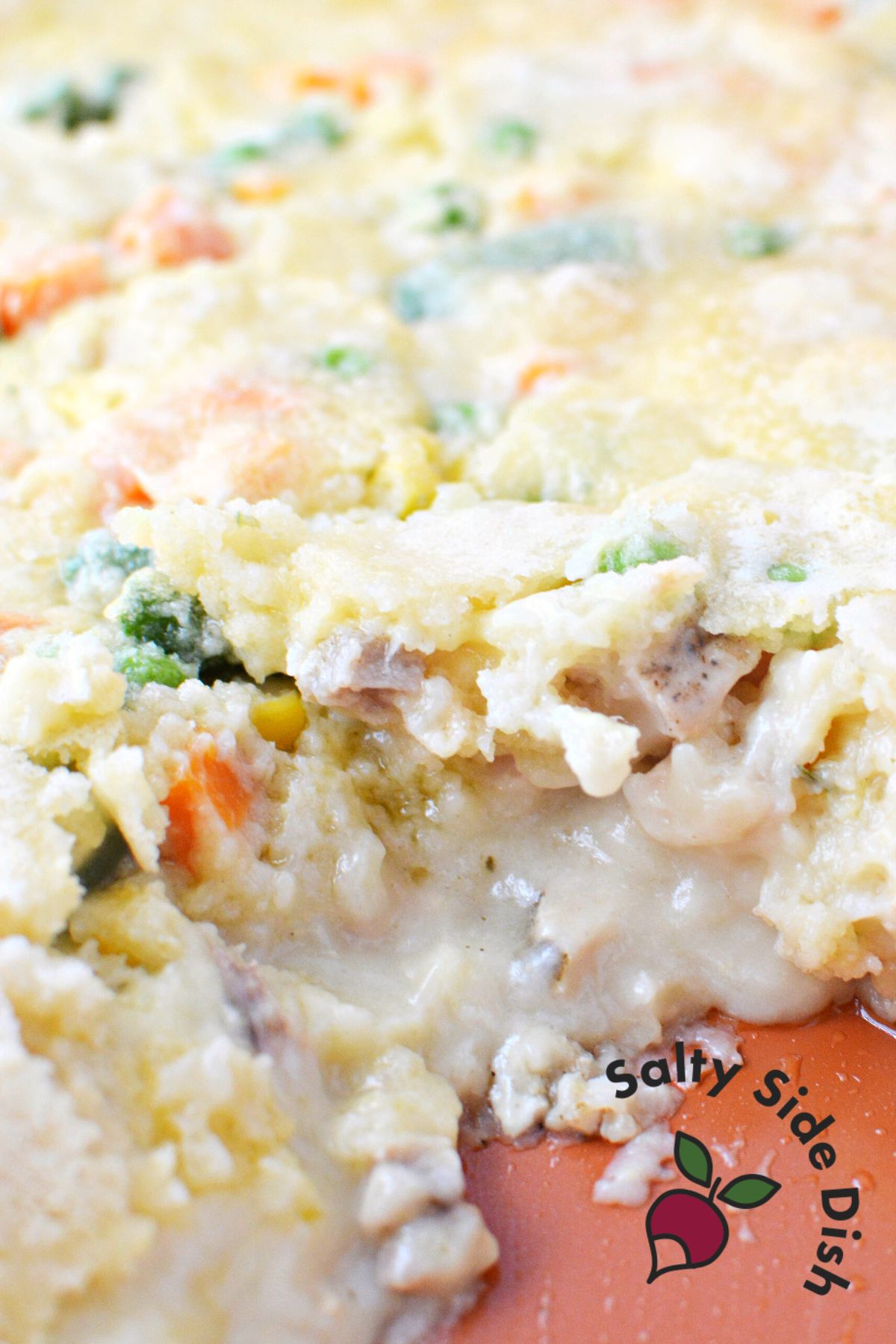 tiktok chicken cobbler recipe in a dish being served.