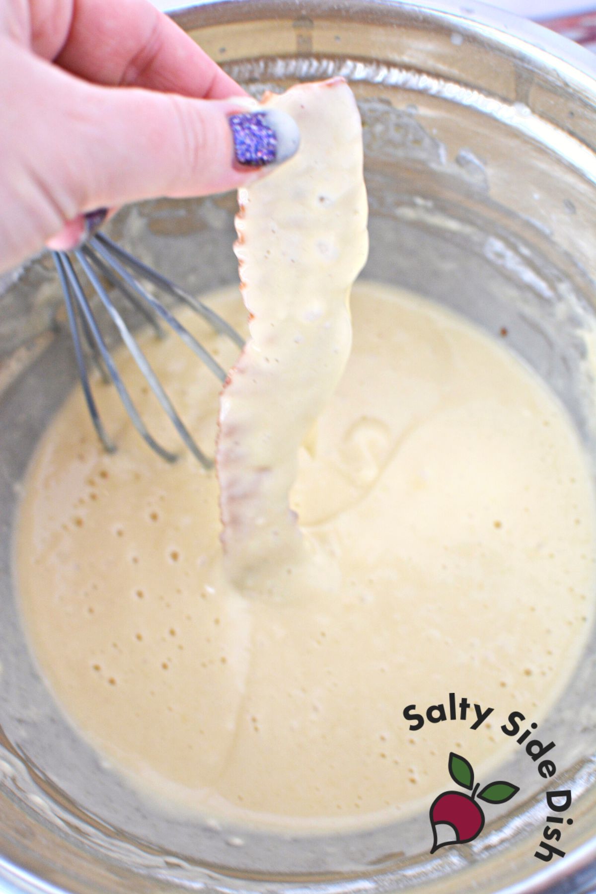 dredging bacon in pancake batter.