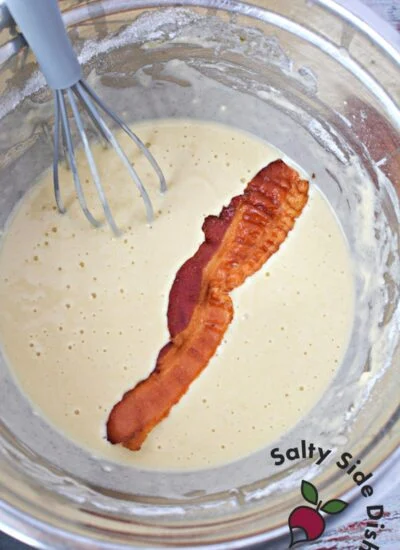 bacon laying in bowl of batter.