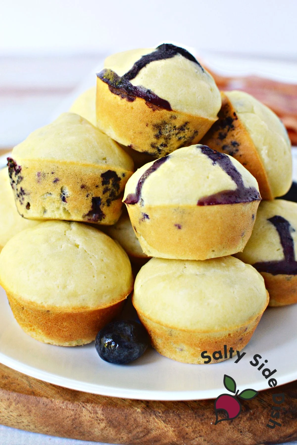 pancake bites piled high on a plate.