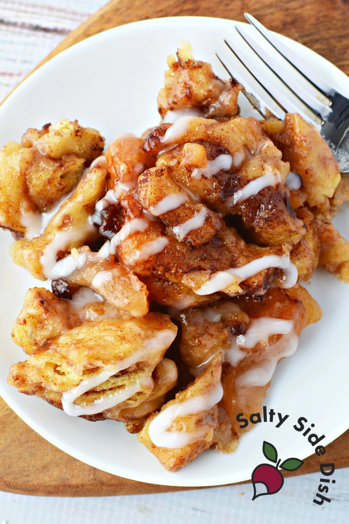 slow cooker apple cinnamon rolls with poured on icing.
