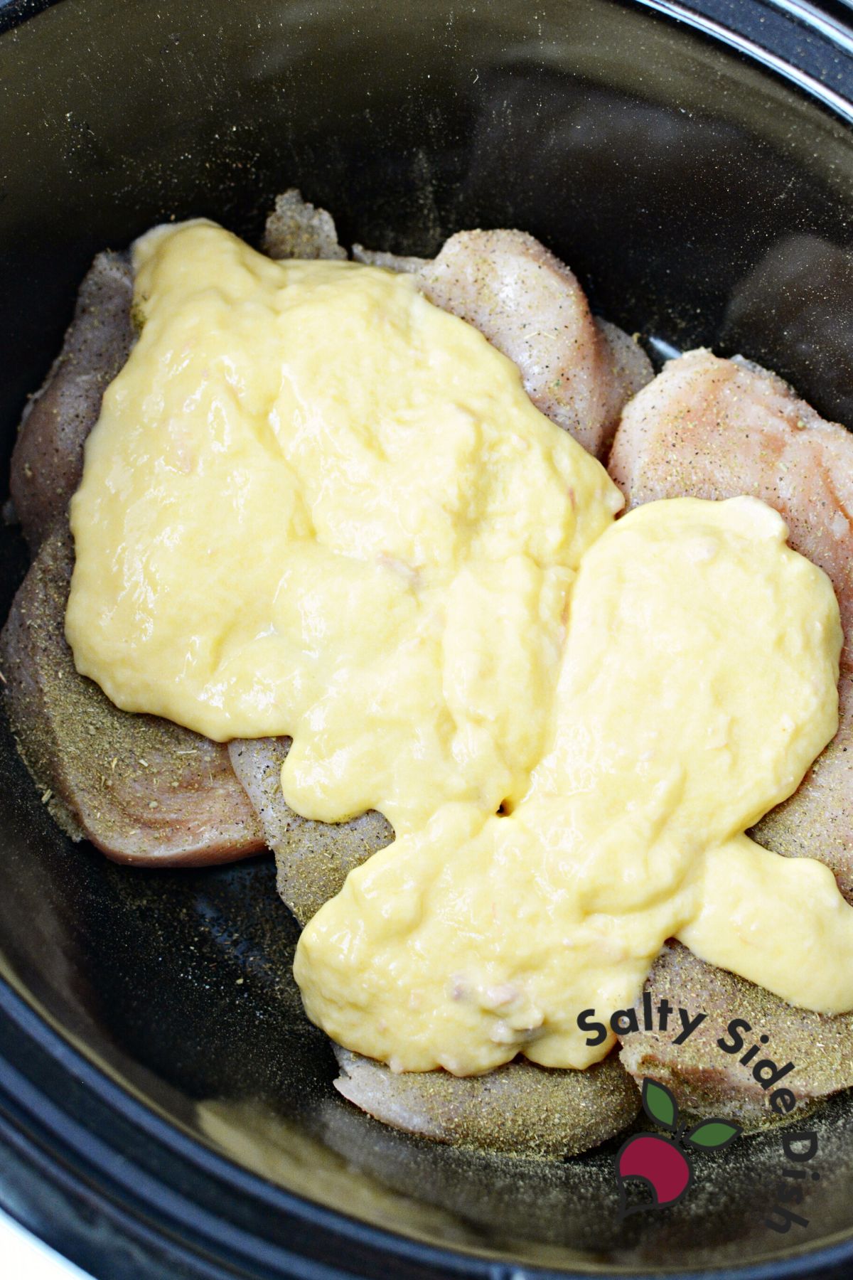 2 cans of cream of chicken soup over chicken breast in a crock pot.