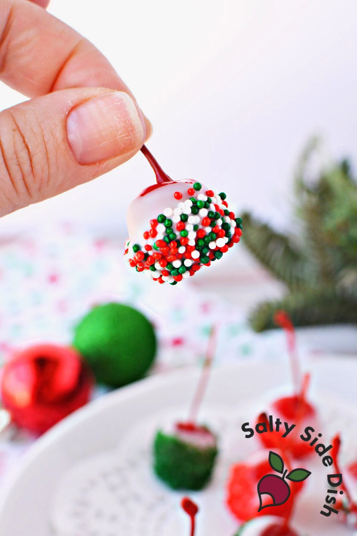 holding a booze soaked cherry perfect for holiday treats.