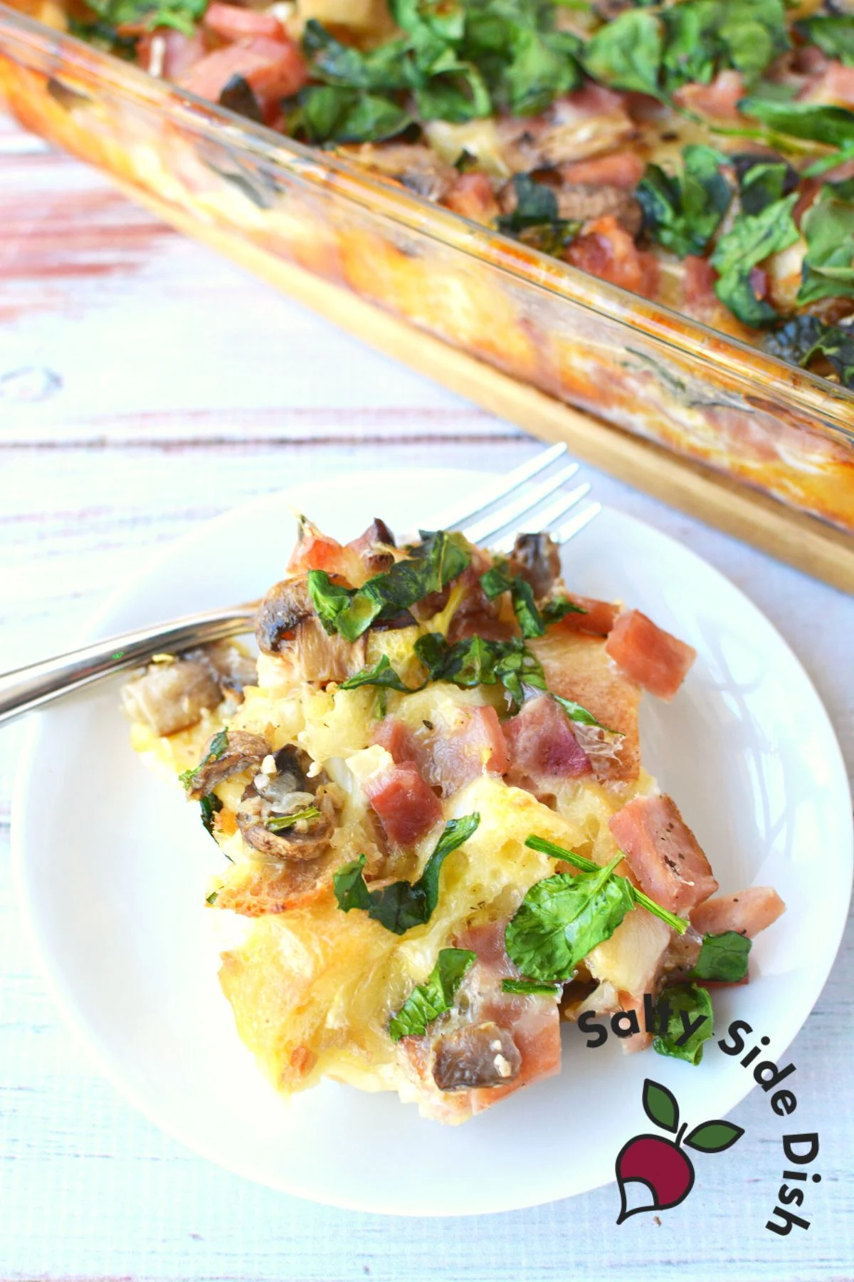 breakfast strata recipe with ham on a plate.