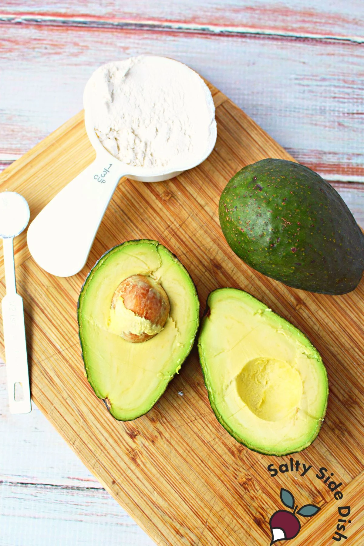 sliced avocado on a cutting board.