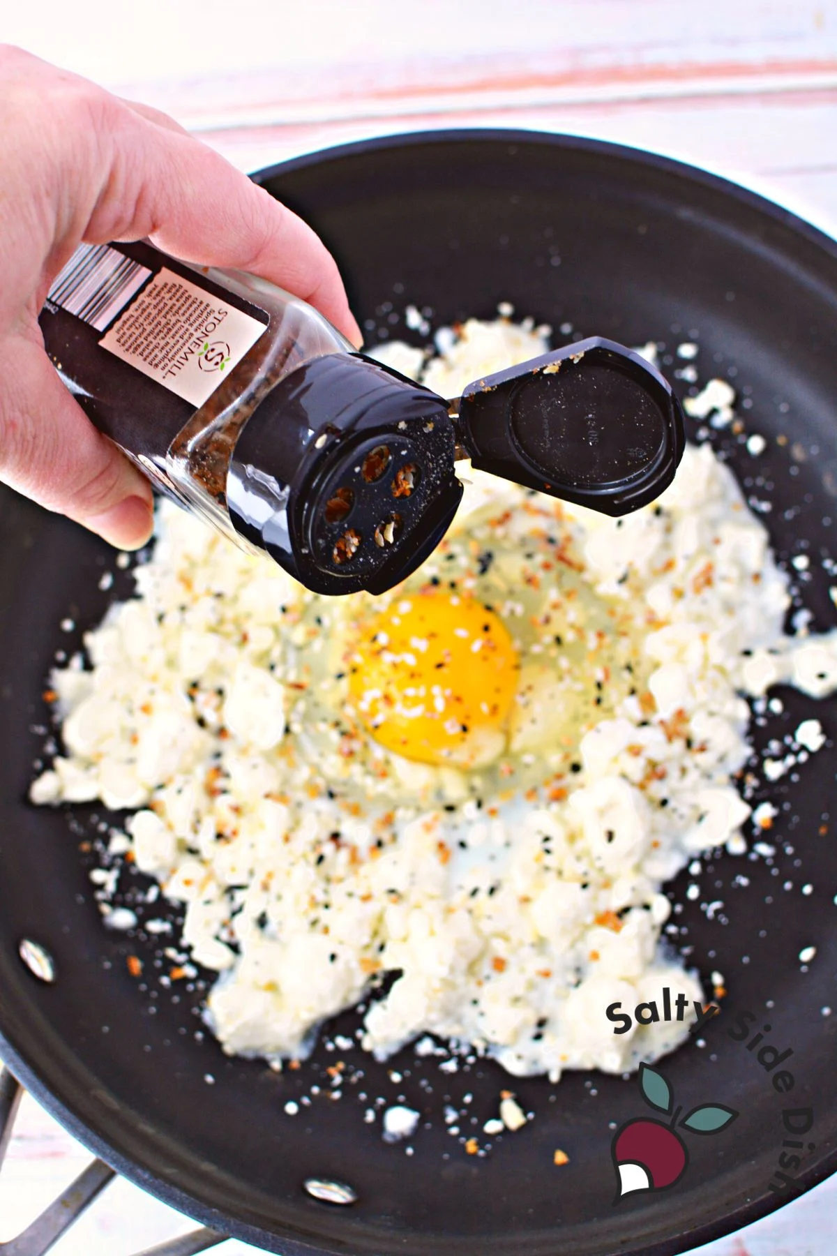 generously sprinkle everything bagel seasoning over eggs.