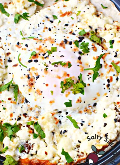 feta fried egg cooked in skillet.