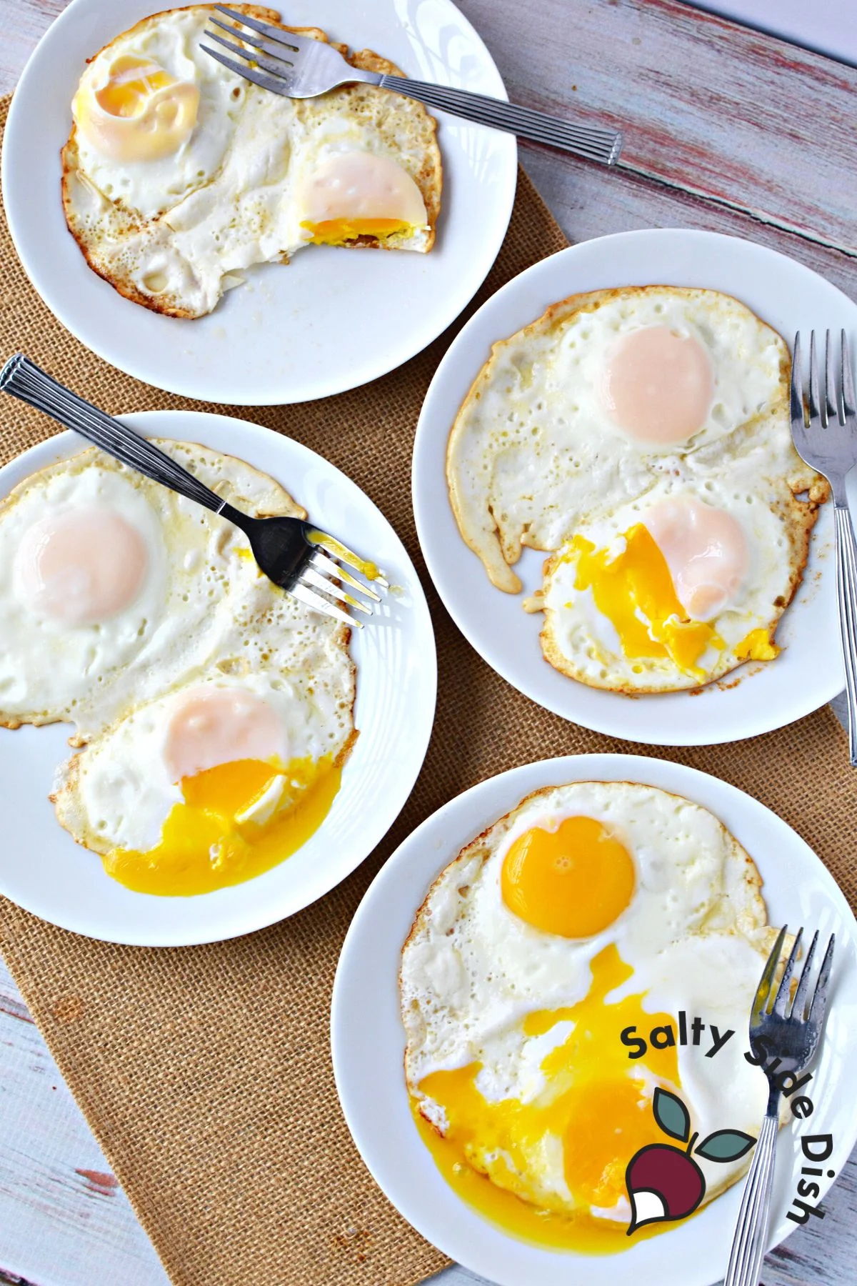 Sunny side up, over-easy, over-medium, and over-hard eggs in different plates.