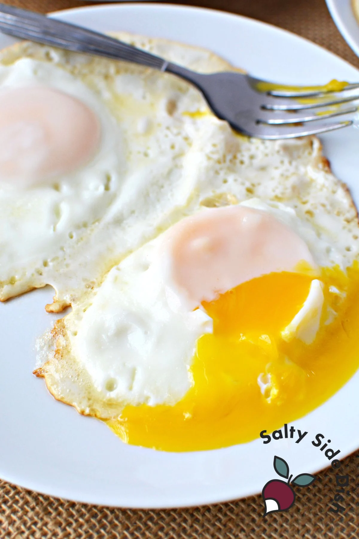 Over-easy eggs on a plate.