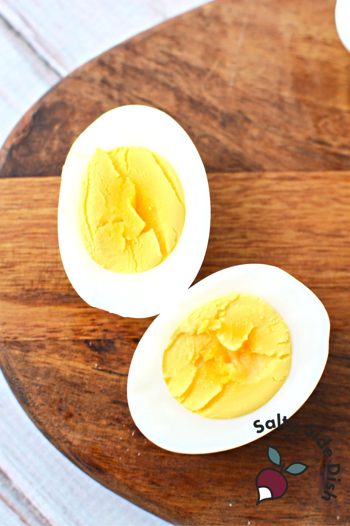 A sliced hard-boiled egg with a very firm, dense yolk.