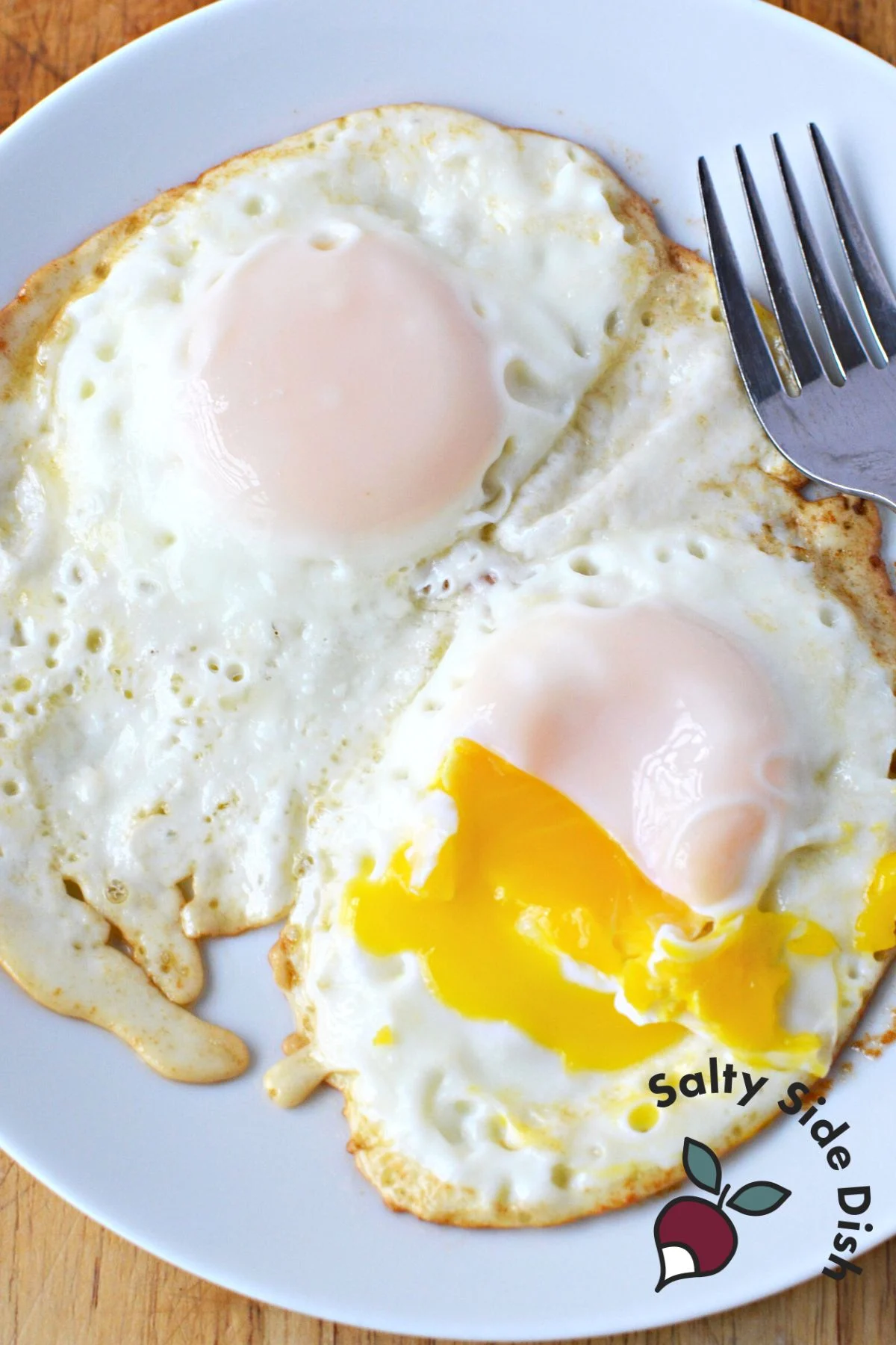 Two over-medium eggs on a plate.