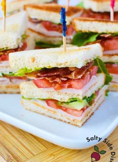 chicken club sandwich stacked with a toothpick.