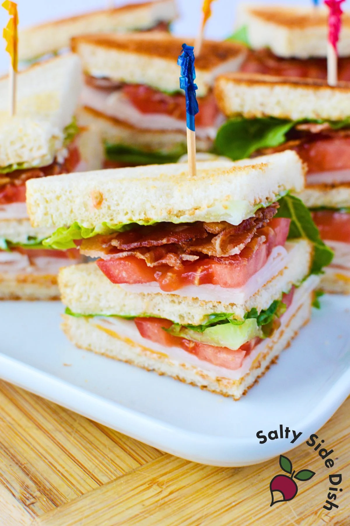chicken club sandwich stacked with a toothpick.