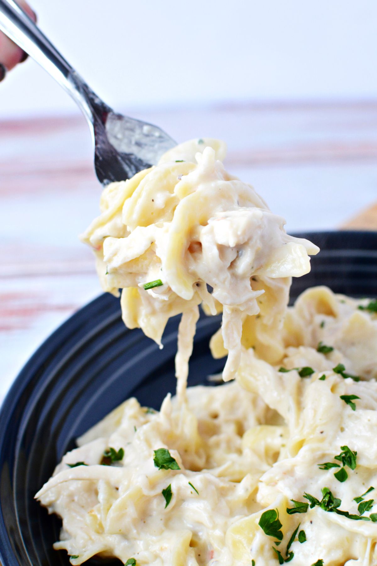 creamy chicken on a fork.